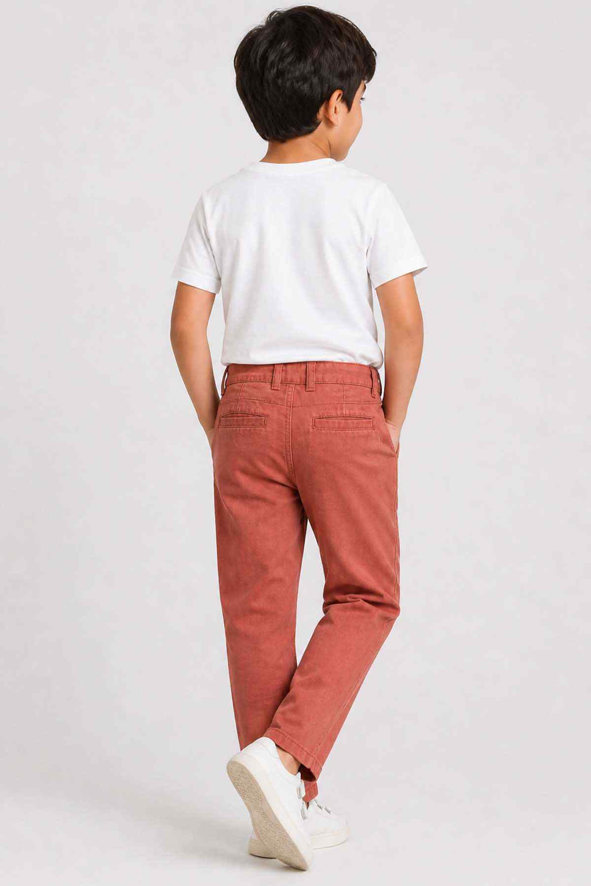 Kids' orange cotton trousers, back view with button waist and ankle-length straight legs