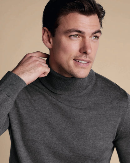 Grey wool turtleneck sweater close-up, ribbed collar and neckline