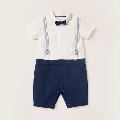 Baby romper with white shirt, navy shorts, bow tie, and suspenders