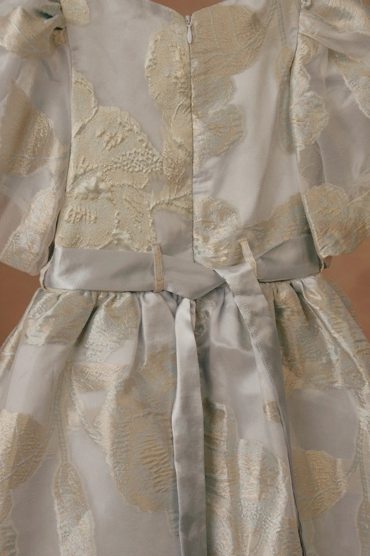 Licci girls cream dress with gold animal print, front button placket and tiered skirt