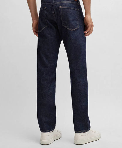 Dark blue fitted jeans back view with yoke stitching and straight tapered legs