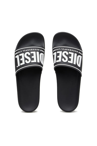 Black slide sandals with 'DIESEL' logo on footbed