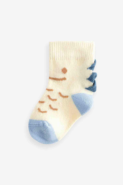 Single kids' crew sock in cream with smiling face and blue accents
