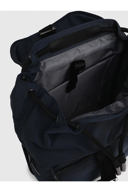 Navy backpack interior with front zip pocket and drawstring cord closure