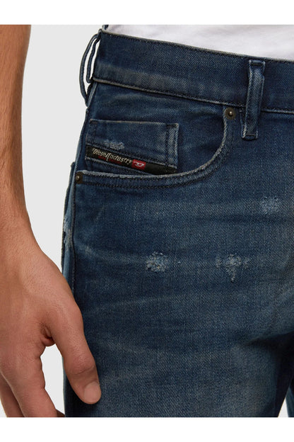Blue denim jeans close-up of front pocket and button fly