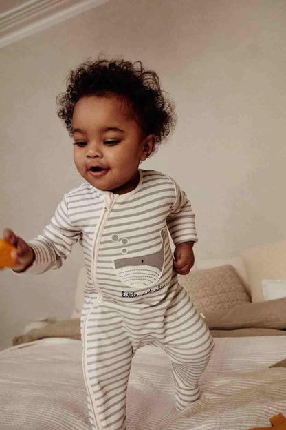 Striped footed baby romper with snap front and illustrated chest pocket.