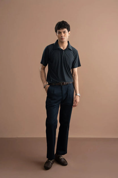 Men's dark polo shirt and trousers with belt
