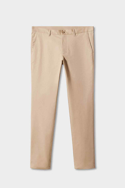 Beige chino pants on hanger, straight legs with belt loops and button closure