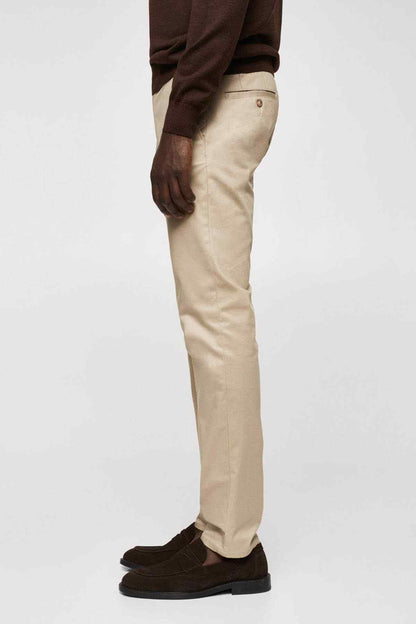 Beige chino pants in straight fit with belt loops and dark sole shoes