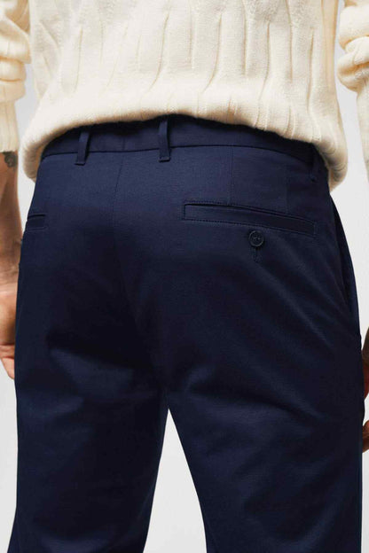 Dark navy trousers with belt loops and single back pocket