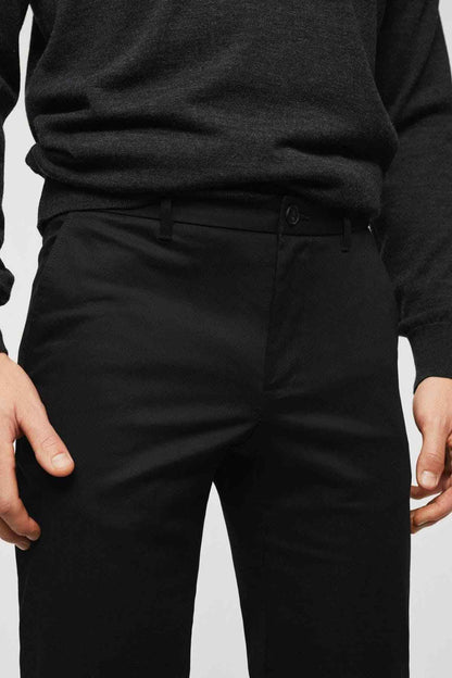 Black trousers waistband with belt loops and buttoned front
