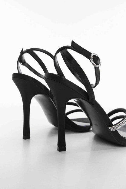 Black strappy high-heel sandals with sparkling rhinestone ankle detail
