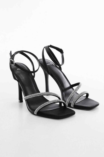Black high-heel sandals with rhinestone crisscross straps