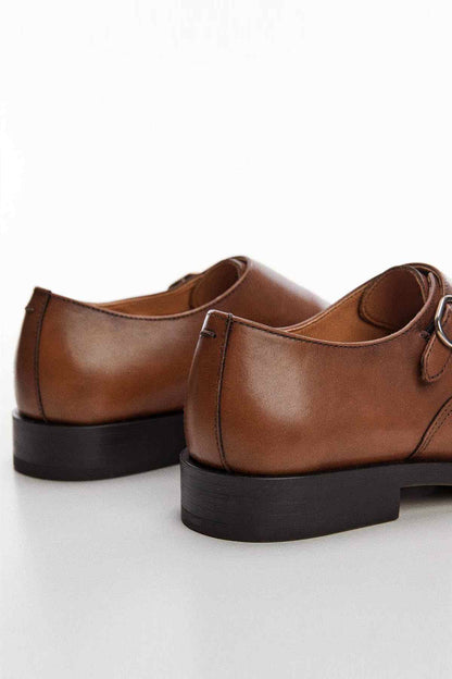 Brown leather monk-strap loafers with chunky dark sole and heel