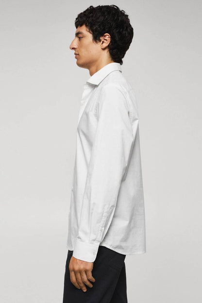 White button-up dress shirt on model from side, long sleeve and classic collar