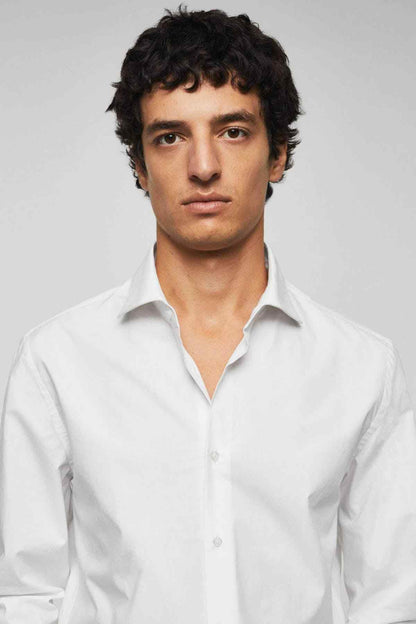 White button-up dress shirt close-up on model, classic collar and button placket