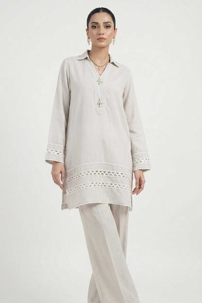 Light grey long tunic with keyhole neckline embroidery and lace cuffs, matching trousers.