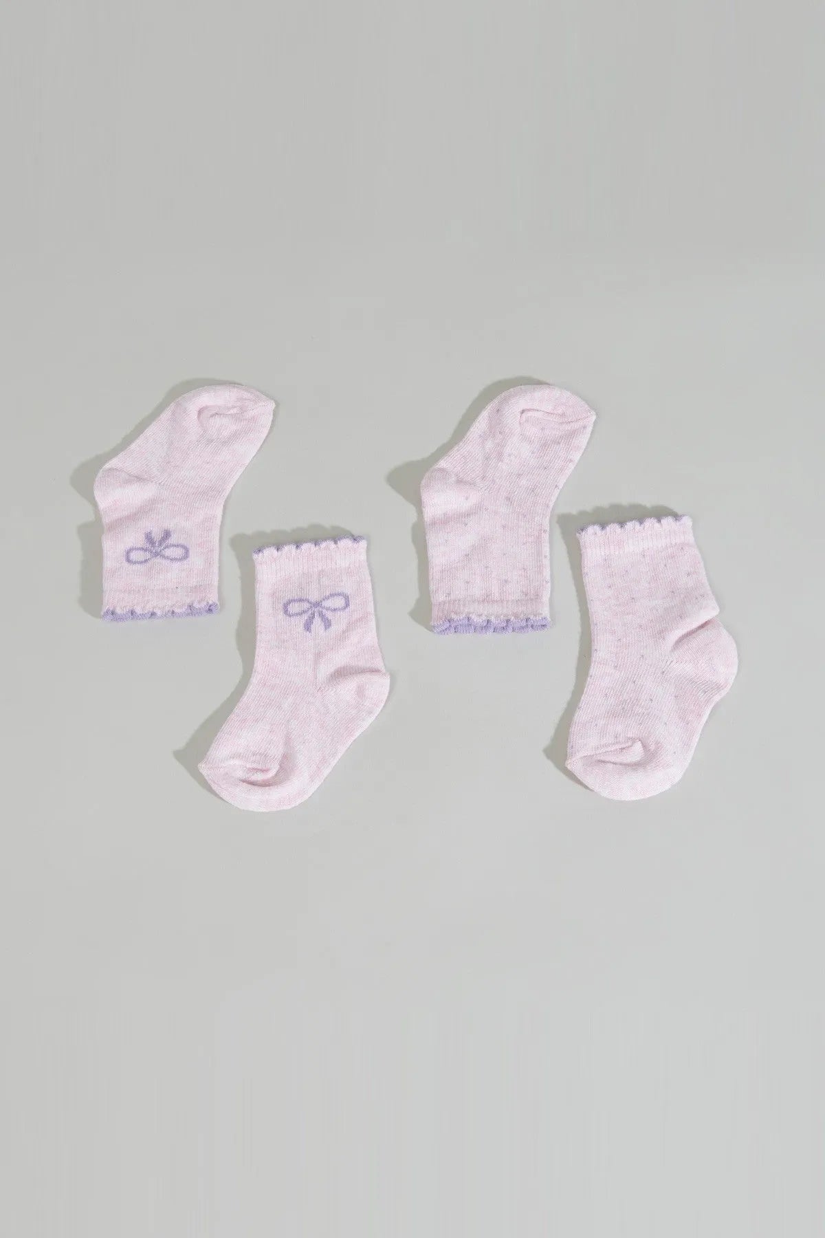 Set of pink baby socks, scalloped cuffs with bow and trim