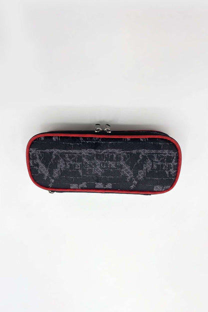 Monster Truck pencil case back with subtle gray print, red zipper trim