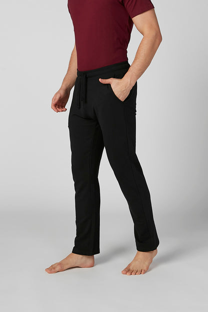 Black jogger pants with drawstring waist and tapered ankle cuffs