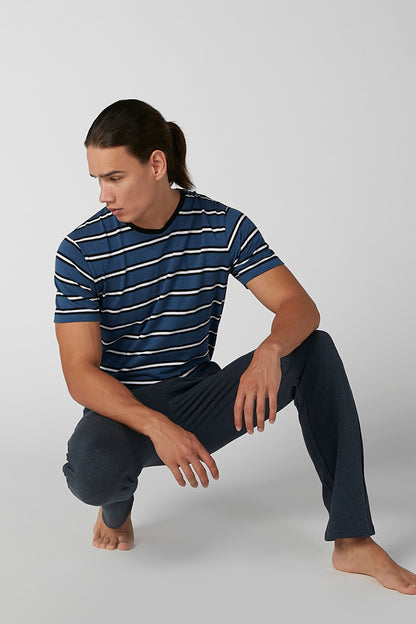 Navy and white striped short-sleeve shirt with dark lounge pants, drawstring waist