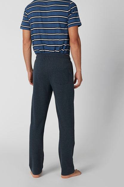 Navy and white striped short-sleeve shirt with dark straight-leg lounge pants