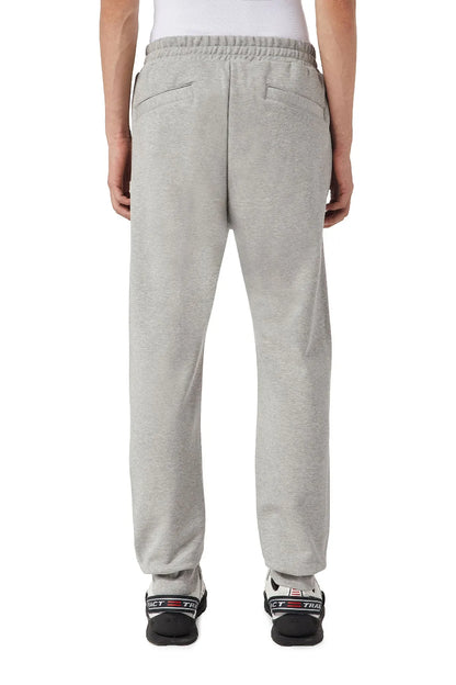 Grey sweatpants with tapered legs and back seam detail