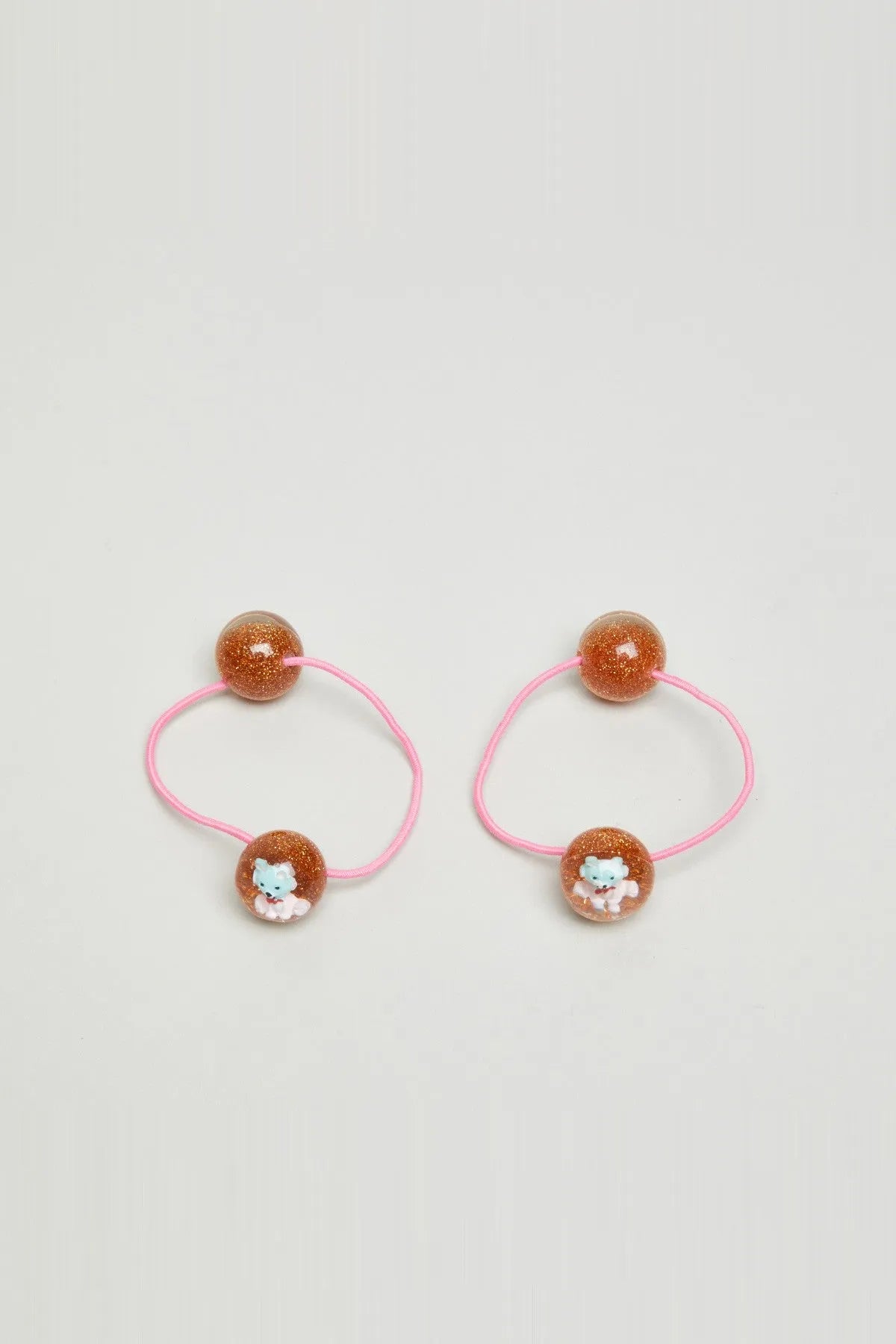 Pair of kids glitter bead hair ties with pink elastic and bunny charms
