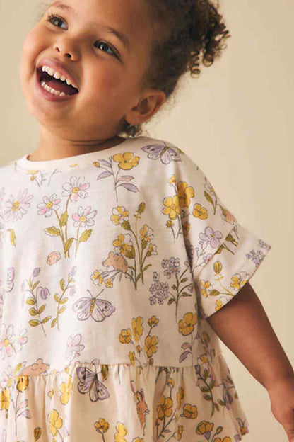 Girls' floral peplum top, close-up of front print and gathered hem