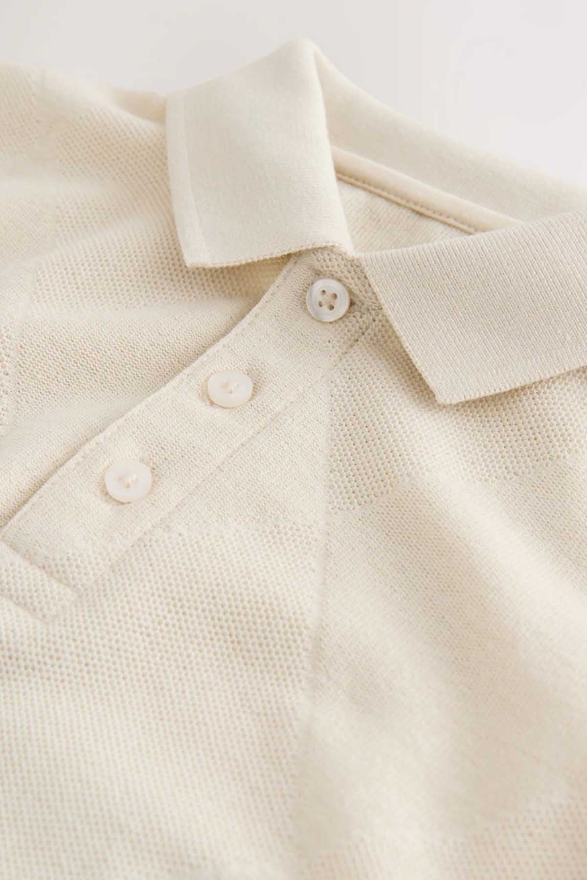 NEXT cream polo shirt placket with three button details and point collar