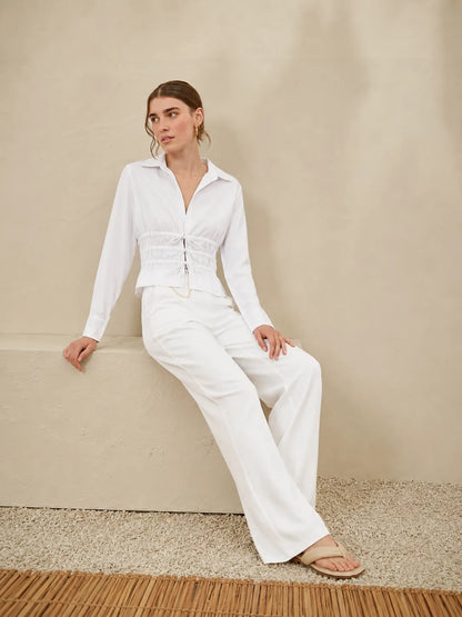 Licci white long-sleeve jumpsuit with button front and wide-leg pants