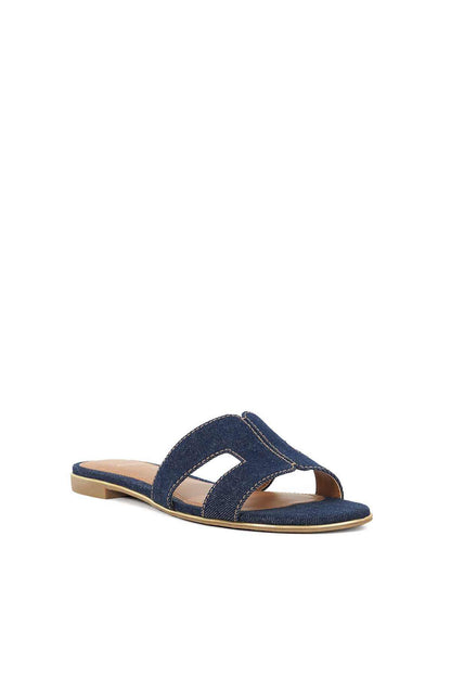 Navy denim slip-on sandals with wide strap over instep and low wooden-look heel
