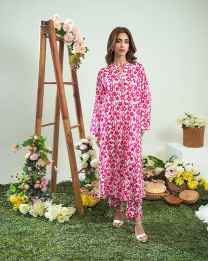 Front-view pink and white leaf-print long-sleeve midi dress with round neckline