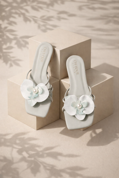 On your Feet pale sea green square-toe slip-on mules with flower embellishments