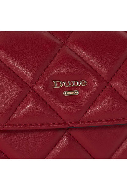 Red quilted handbag close-up with Dune London logo emblem