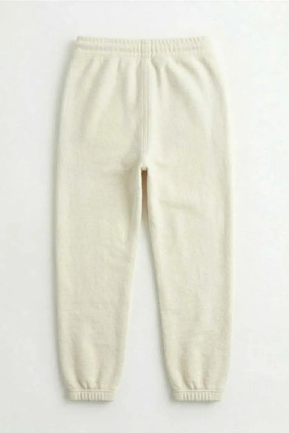 MEME cream jogger pants with elastic waistband and cuffed hems, back view