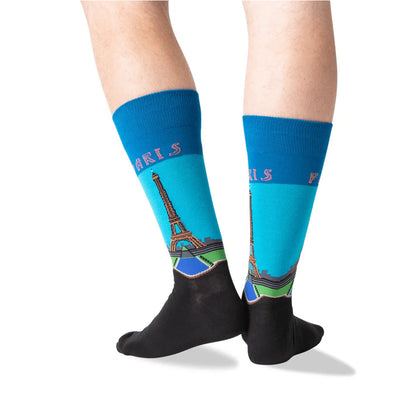 Pair of blue crew socks with Eiffel Tower Paris print and black toe sections