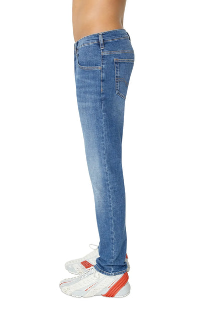 Blue denim jeans with straight legs and belt loops, side seam visible