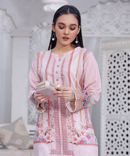 Women's pink embroidered long kurta with floral print, buttoned front, sheer sleeves