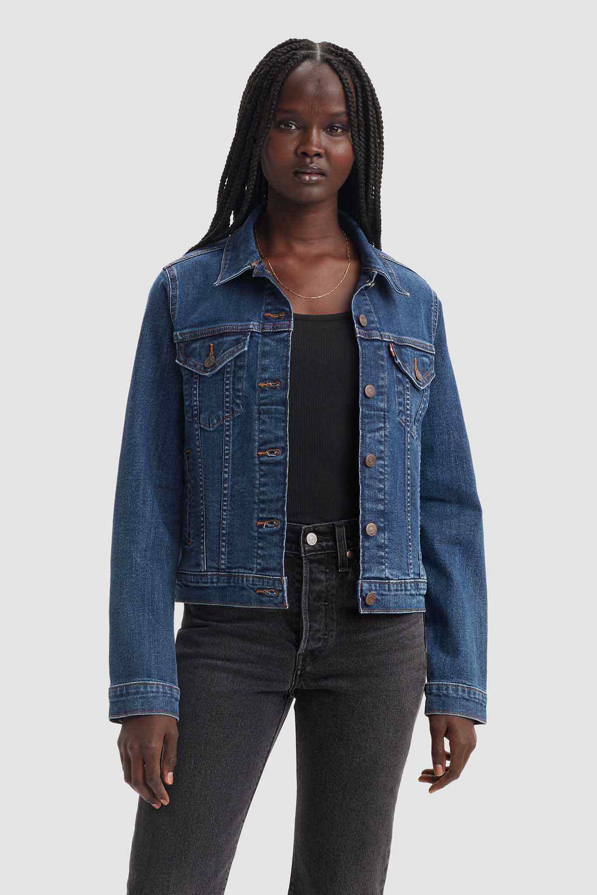 Dark indigo denim jacket with button front, flap chest pockets, long sleeves