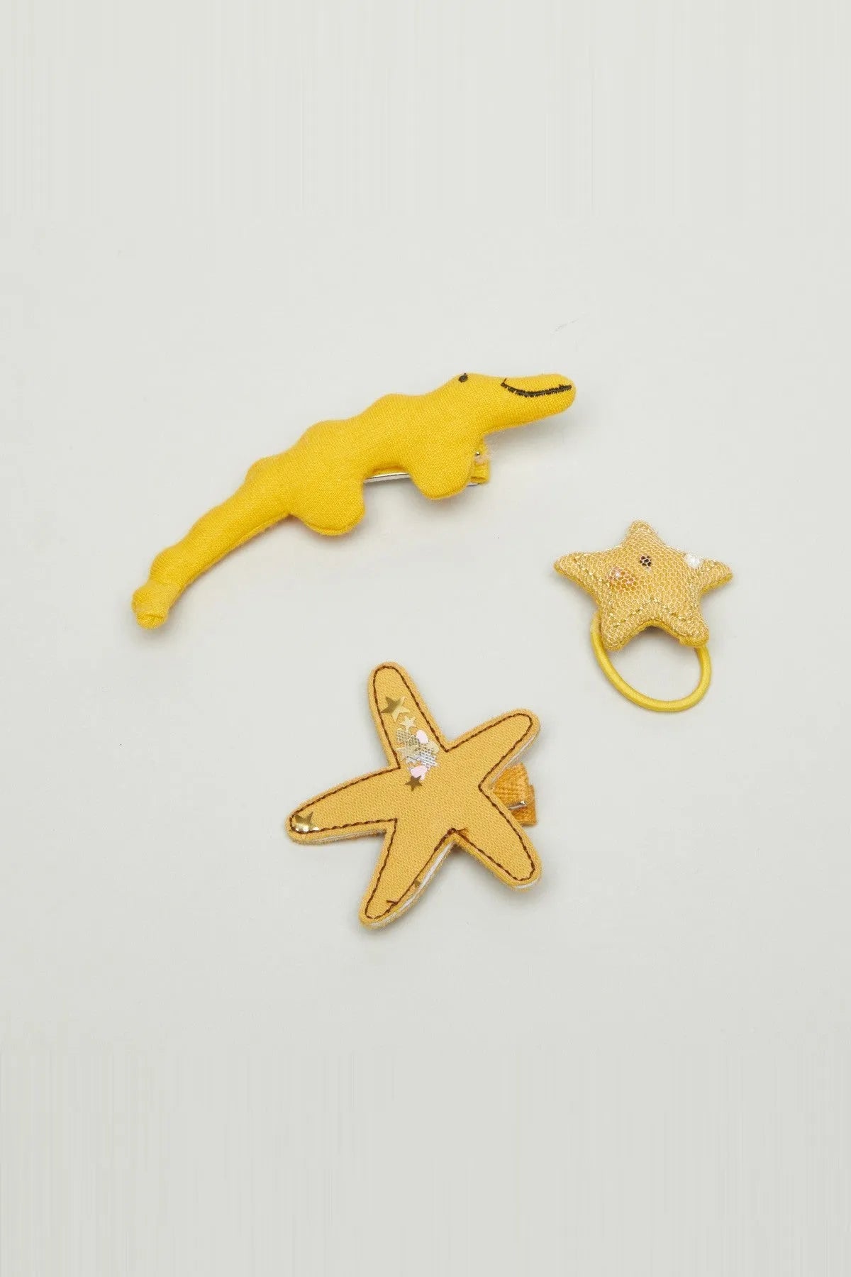 Yellow felt pacifier clips with star and dolphin shapes, silver clasps