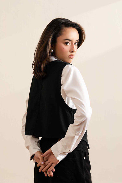 Fitted black sleeveless vest with V-neck and button closure, side view