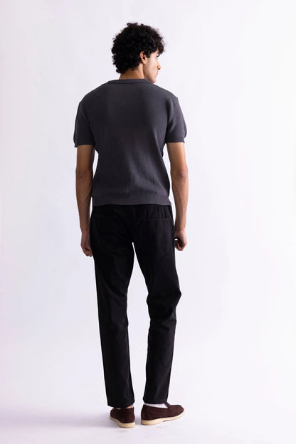 Men's dark gray polo shirt back view with short sleeves and ribbed hem
