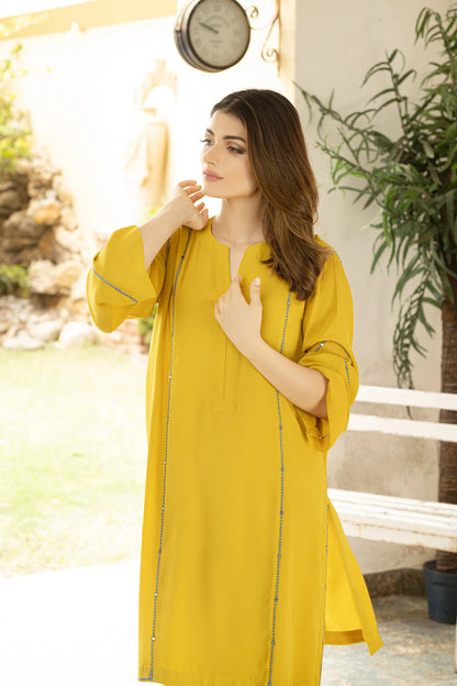 Lime yellow velour tunic close-up with round neckline and long sleeves