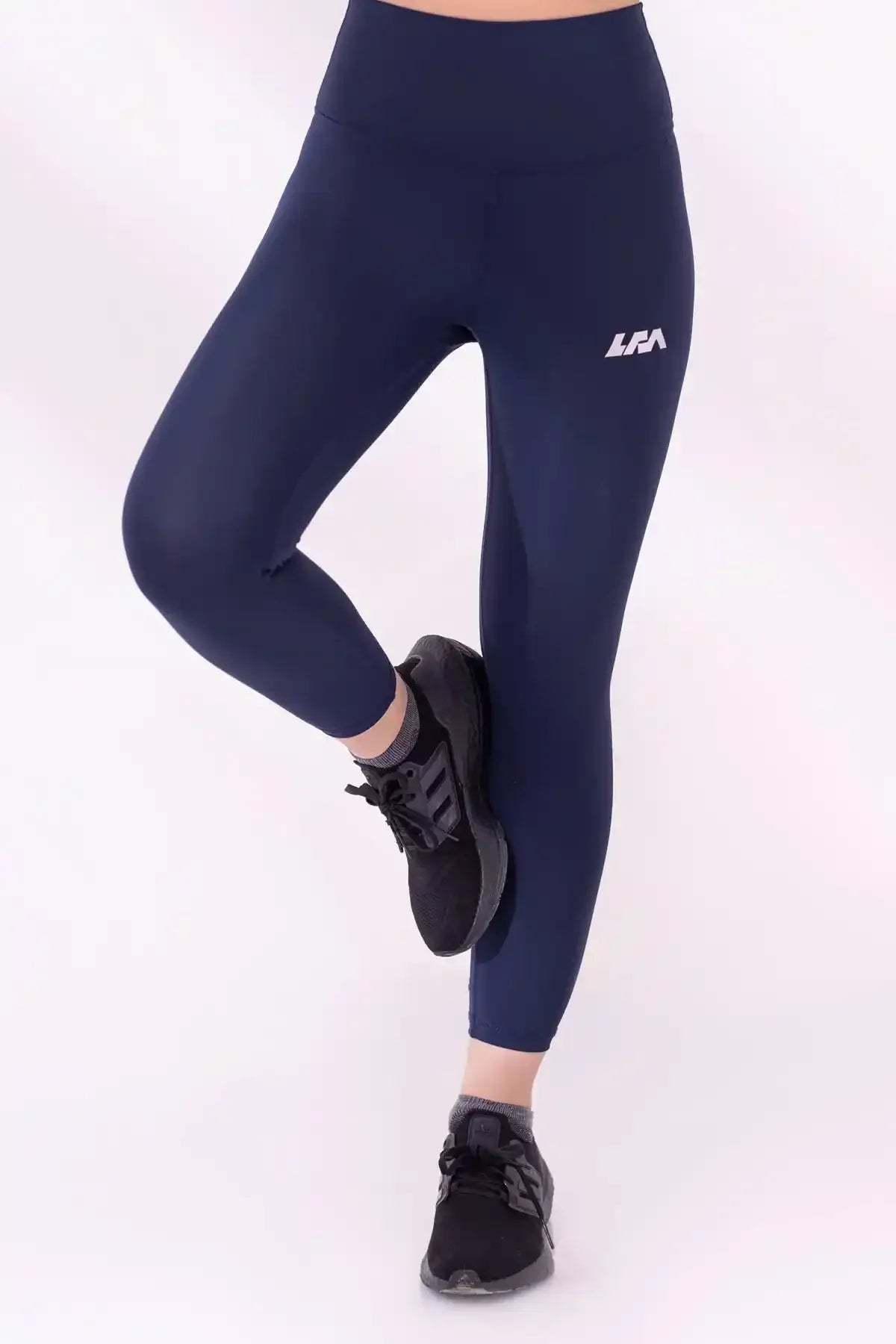 Navy blue compression leggings, ankle-length, side seam with LRA logo