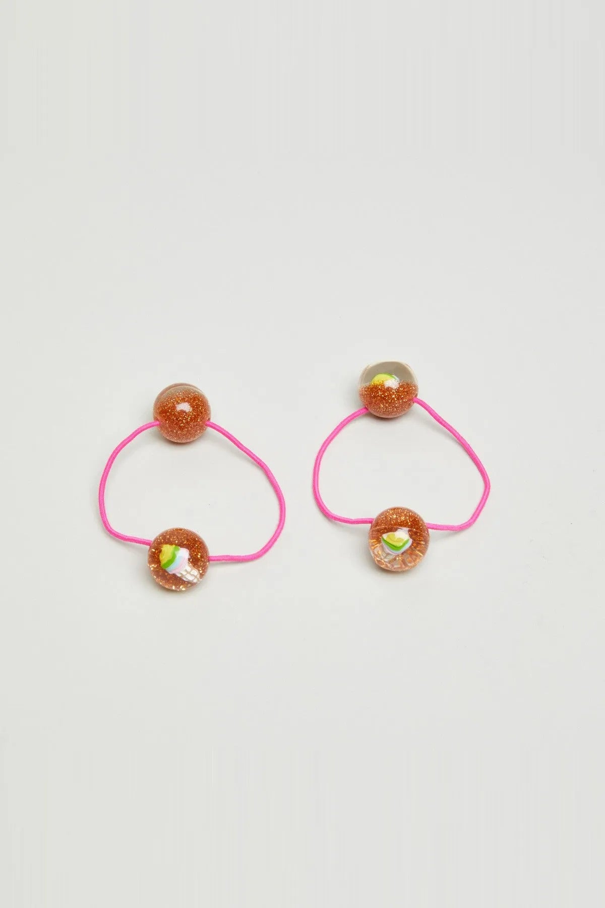 Set of two glitter bead hair ties: pink elastic with round orange sparkle beads