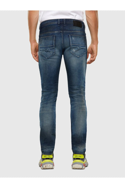 Back view of blue jeans with rear pockets and subtle faded wash
