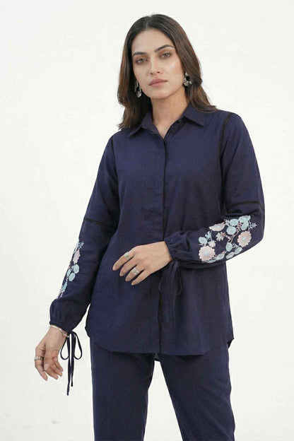 Navy blue tunic shirt with floral embroidered sleeves and matching pants, drawstring ties
