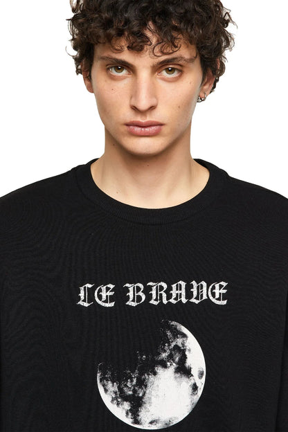 Black crewneck sweatshirt close-up of ICE BRANE moon graphic