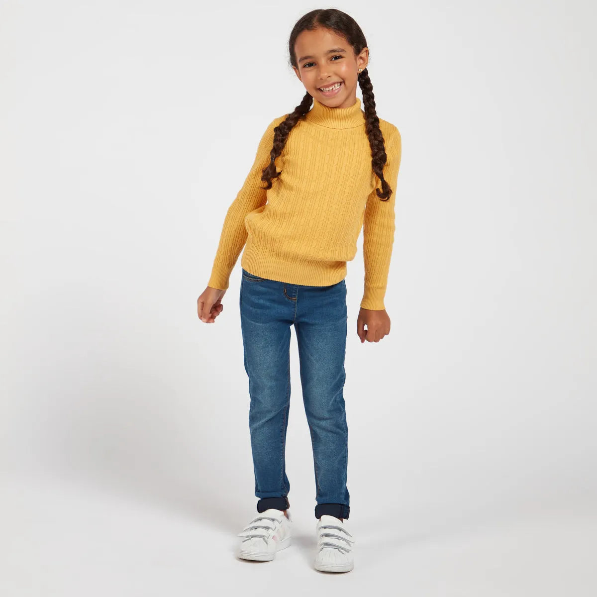 Kids mustard knit turtleneck sweater with blue denim jeans